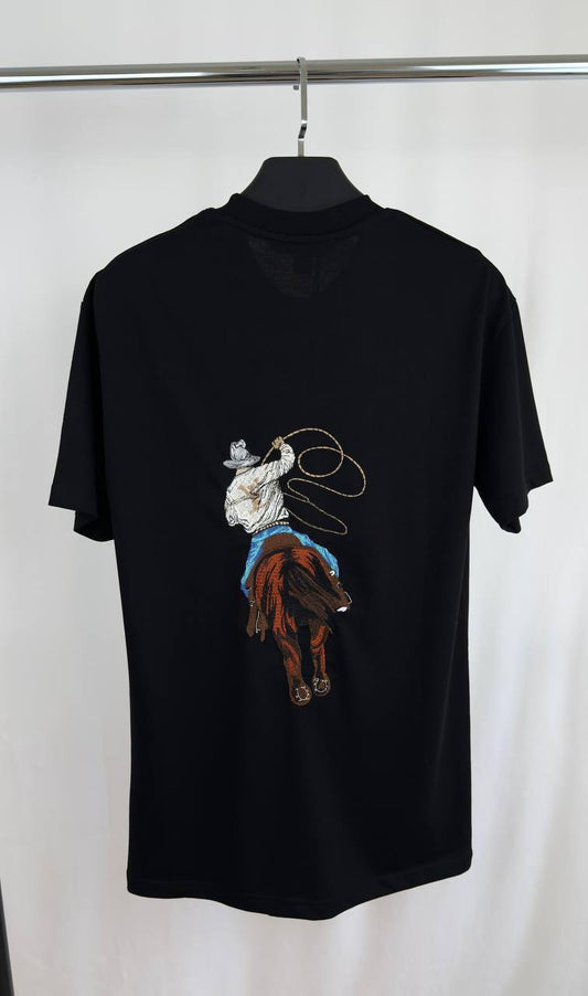Louis Vuitton Graphic Embroidered Cotton T-Shirt, Featuring a Cowboy Motif with a Lasso & an LV Ropes Signature