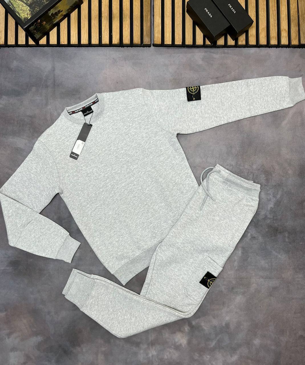 Stone Island Tracksuit with Brand's Iconic Compass Badge.